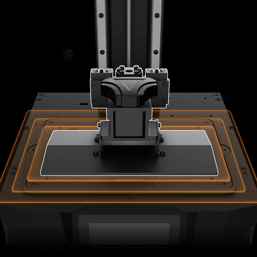 Close-up of a 3D printer extruder above the heated print bed with an orange outline highlighting the platform edge.