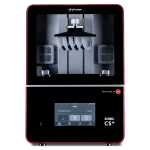 Inside a red-framed Phrozen 3D printer, showing the build chamber with resin-arch supports and metal hardware centered under a black hood.