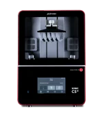 Inside a red-framed Phrozen 3D printer, showing the build chamber with resin-arch supports and metal hardware centered under a black hood.