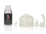 Bottle of LIQCREATE Bio-Med Flex biocompatible resin with white cap, shown beside white 3D-printed mask components.